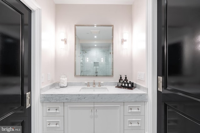 bathroom featuring a stall shower and vanity