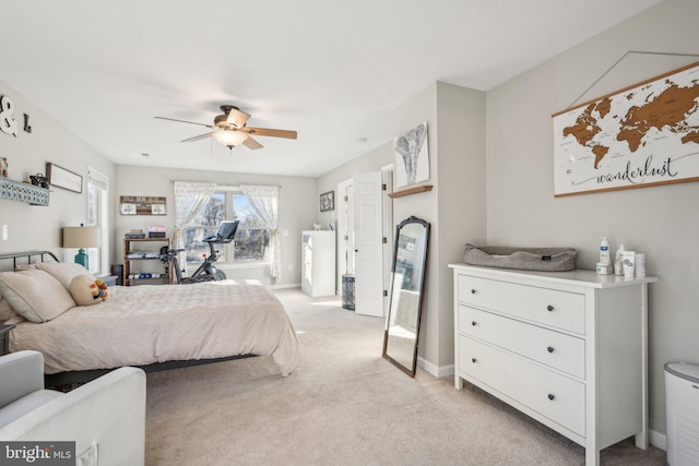bedroom featuring light carpet, baseboards, and a ceiling fan