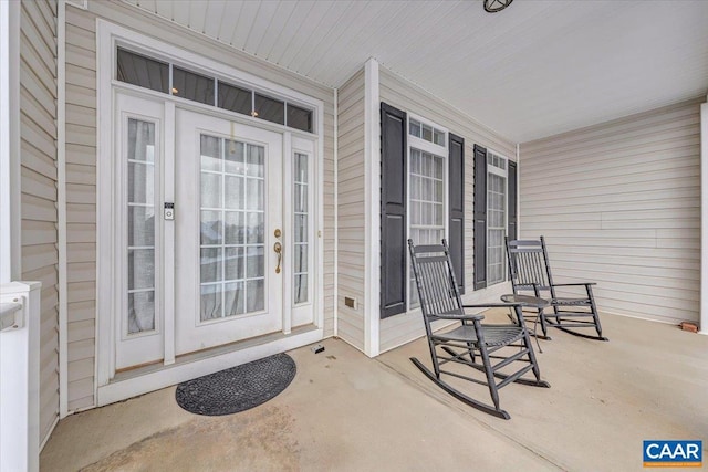 entrance to property featuring a porch