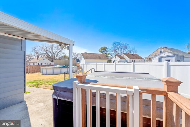 view of yard with a residential view, a fenced in pool, and a fenced backyard