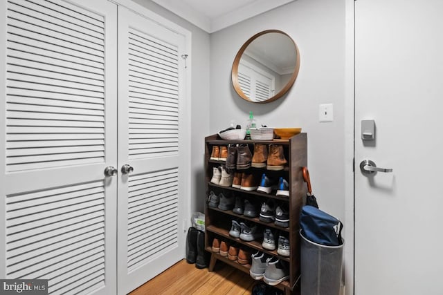 interior space featuring ornamental molding and wood finished floors