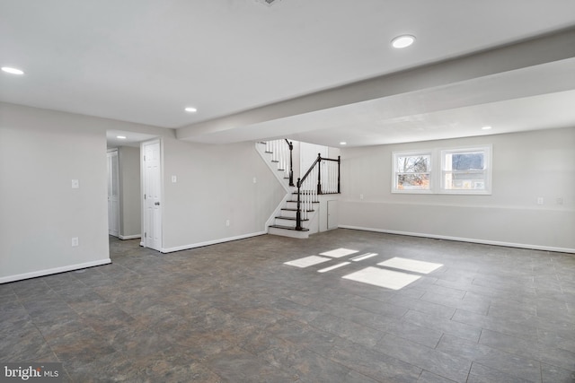 basement with stairs, recessed lighting, and baseboards