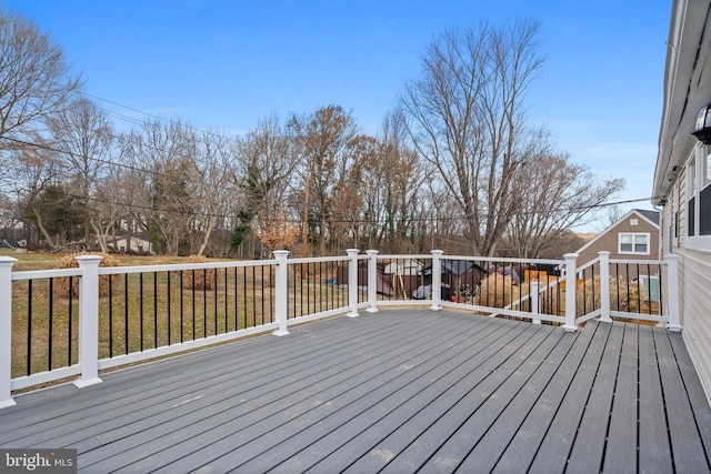 wooden deck with a yard