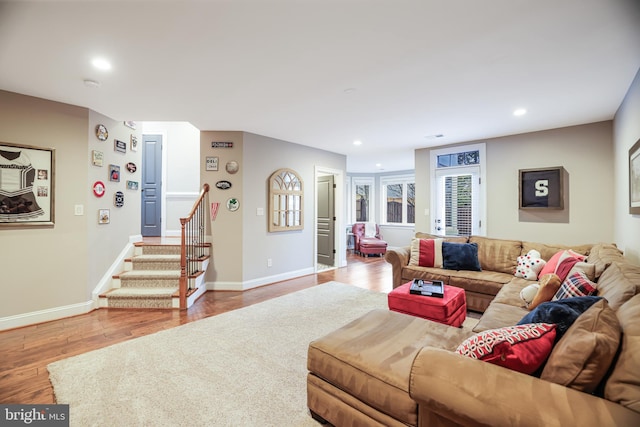 living room with stairs, recessed lighting, baseboards, and wood finished floors