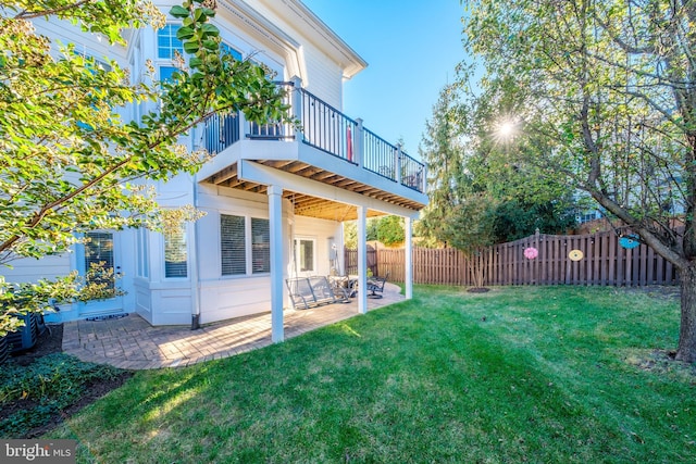 view of yard featuring a patio area and a fenced backyard