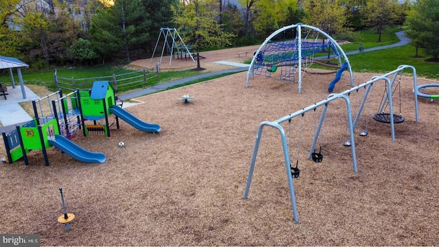 communal playground featuring a yard