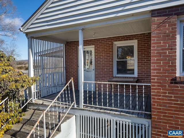 property entrance featuring brick siding