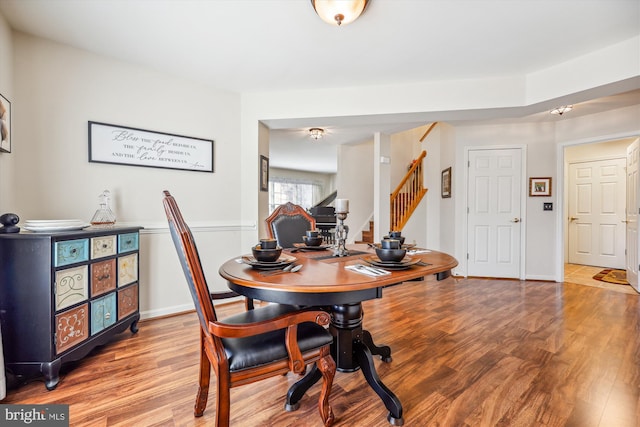 home office featuring baseboards and wood finished floors