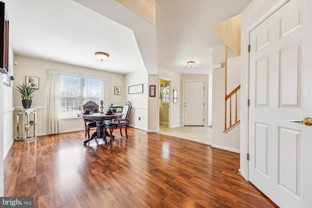 interior space featuring wood finished floors and baseboards