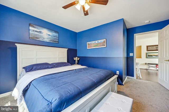 bedroom with carpet floors, baseboards, and a ceiling fan