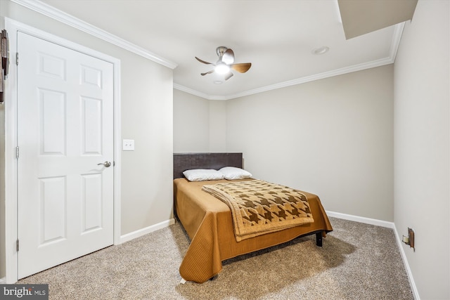 bedroom featuring carpet, baseboards, and crown molding