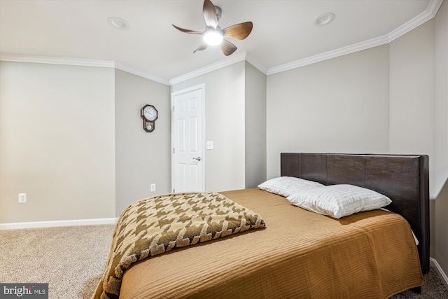 bedroom with carpet flooring, crown molding, baseboards, and ceiling fan