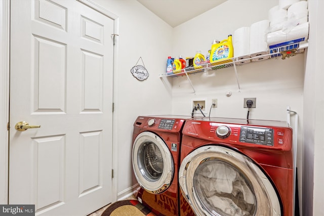 clothes washing area with washer and dryer and laundry area