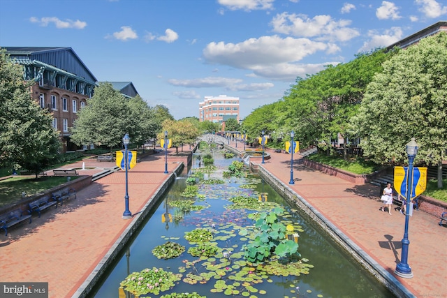 view of home's community with a water view