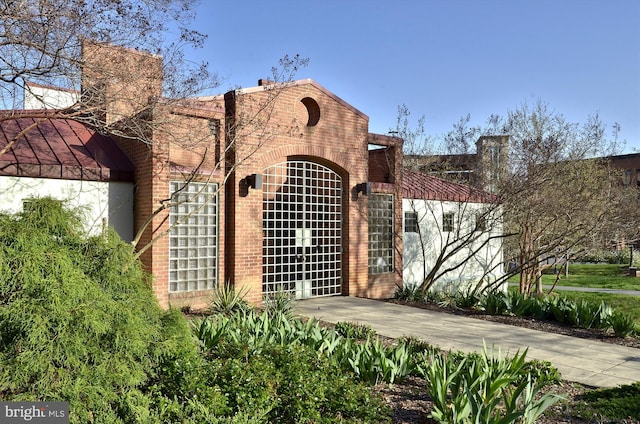 view of front of house featuring brick siding