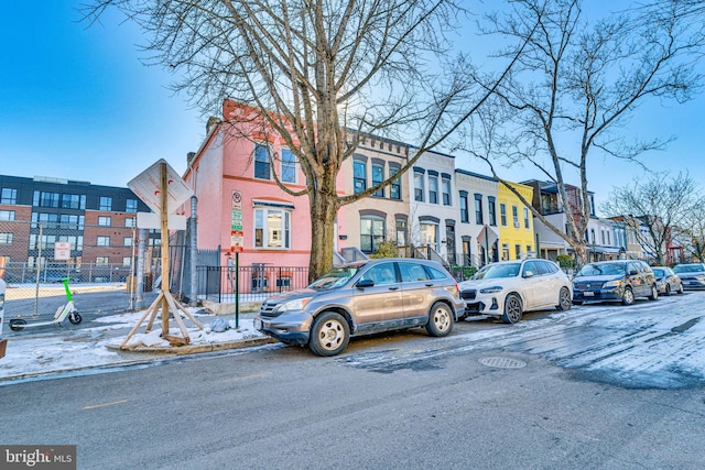 view of street featuring curbs, street lighting, and sidewalks