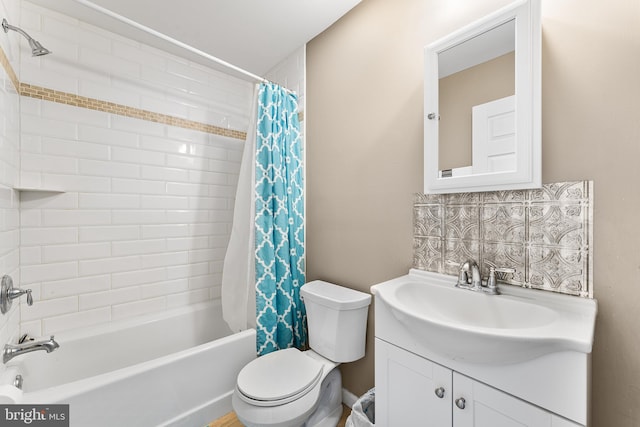 full bathroom with vanity, shower / bath combination with curtain, and toilet