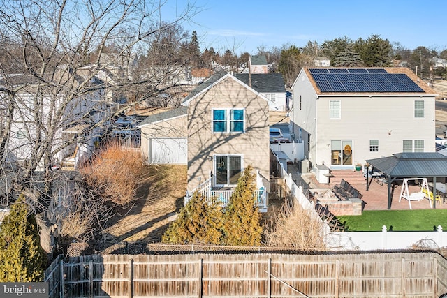 exterior space with a patio area and a fenced backyard