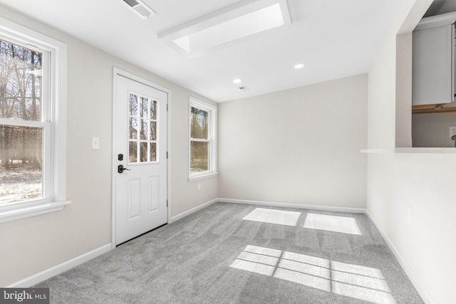 foyer with light carpet, baseboards, visible vents, and recessed lighting