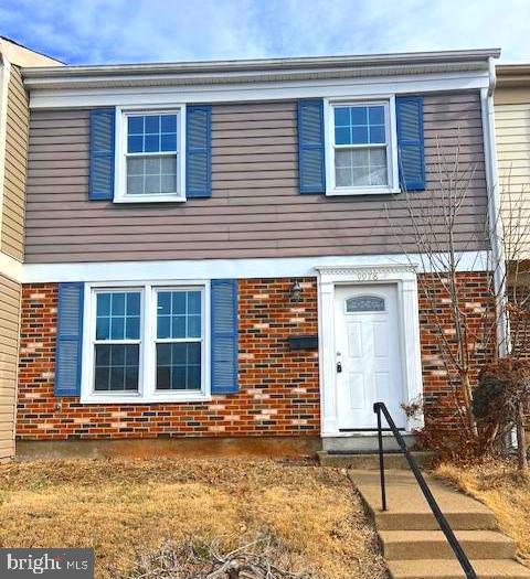 view of front of home with brick siding