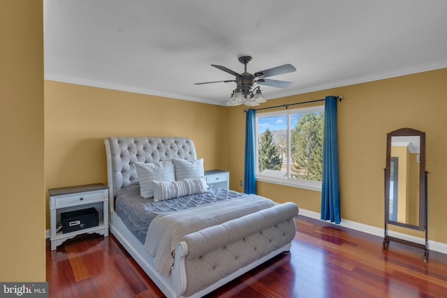 bedroom with ornamental molding and wood finished floors