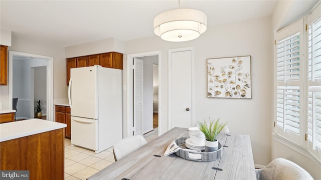 dining area featuring light tile patterned floors