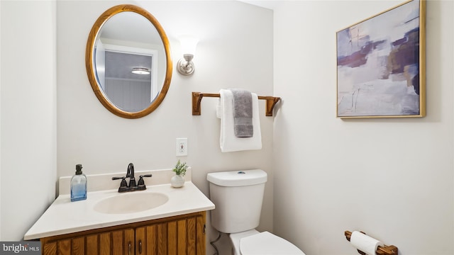 bathroom with toilet and vanity