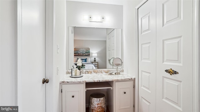 ensuite bathroom featuring vanity and ensuite bathroom