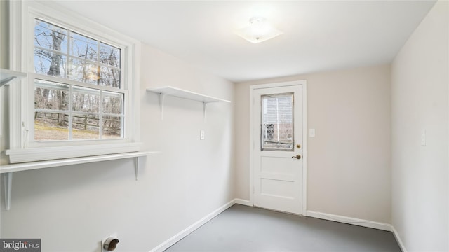 laundry room with laundry area and baseboards