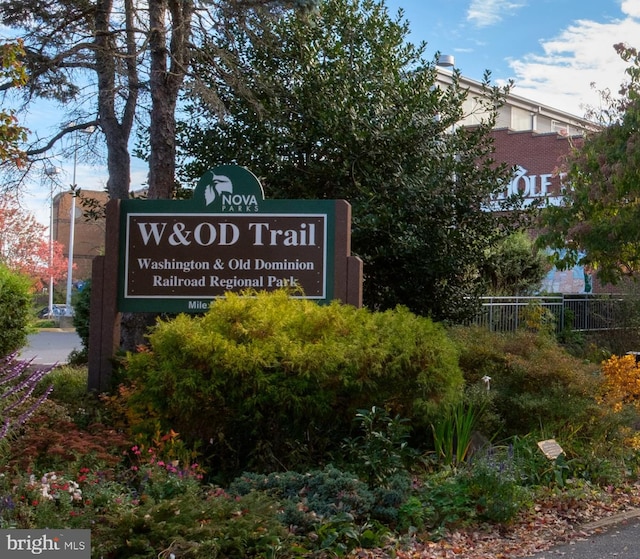 community sign with fence