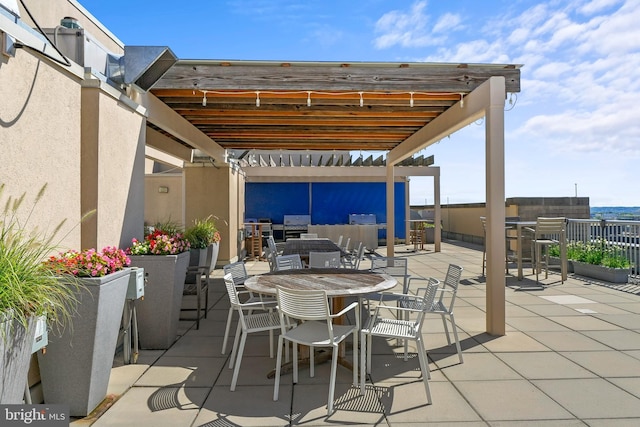 view of patio with outdoor dining area and a pergola