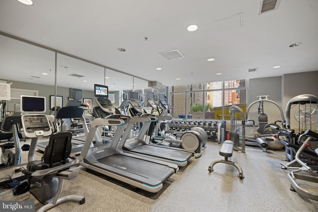 exercise room with visible vents and recessed lighting