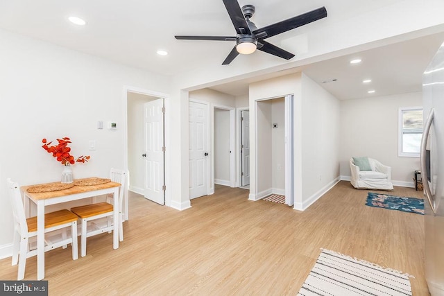 living area with light wood finished floors, ceiling fan, baseboards, and recessed lighting