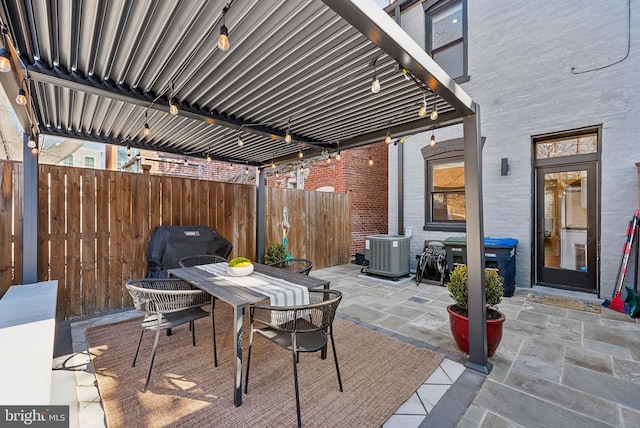 view of patio / terrace featuring cooling unit, outdoor dining area, fence, and a pergola