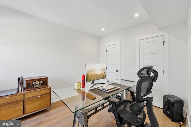 office featuring baseboards, recessed lighting, and light wood-style floors