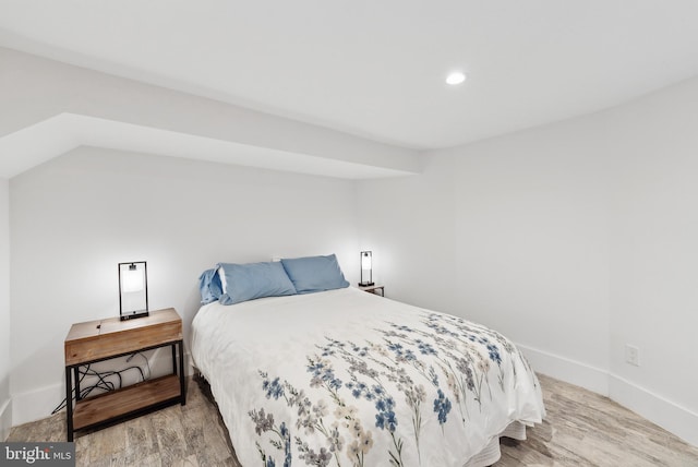 bedroom featuring recessed lighting, light wood-style flooring, and baseboards