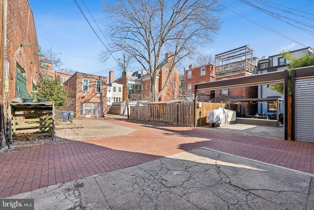 exterior space featuring fence and a residential view