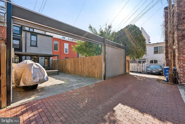 exterior space with fence and area for grilling