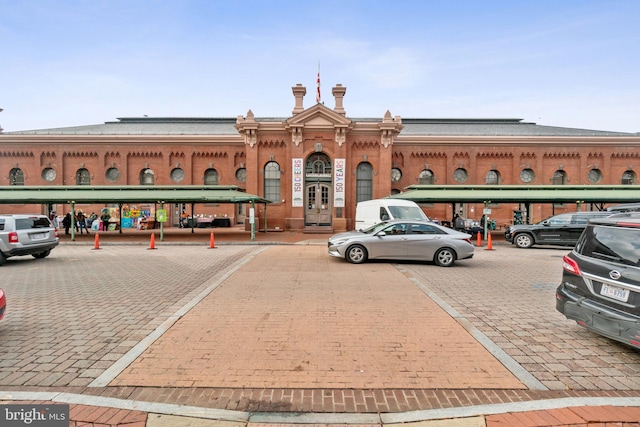 view of building exterior featuring uncovered parking