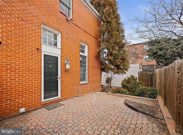 view of patio / terrace featuring fence