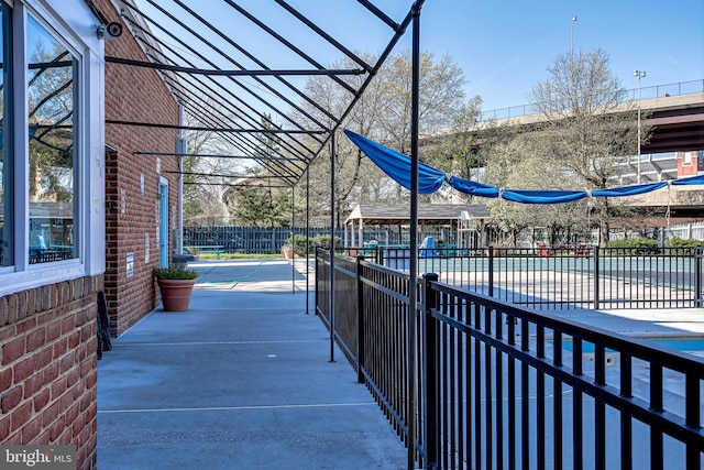 view of home's community with fence