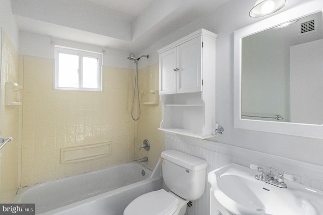 full bathroom featuring toilet, visible vents, shower / washtub combination, and a sink