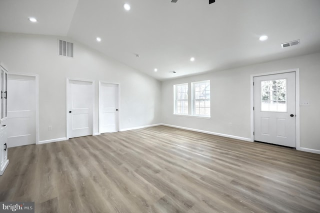 interior space featuring light wood-style floors, recessed lighting, visible vents, and baseboards