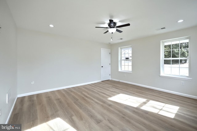 spare room featuring visible vents, baseboards, light wood-style flooring, ceiling fan, and recessed lighting