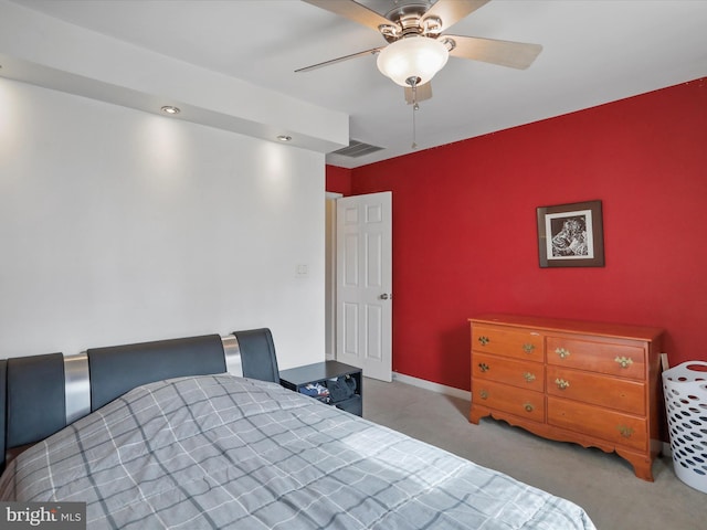 bedroom with light carpet, baseboards, visible vents, and ceiling fan