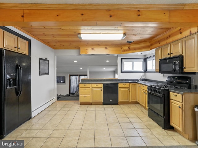 kitchen with light tile patterned floors, dark countertops, light brown cabinetry, a baseboard heating unit, and black appliances