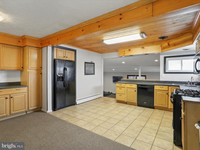 kitchen with a baseboard heating unit, dark countertops, black appliances, and light tile patterned floors