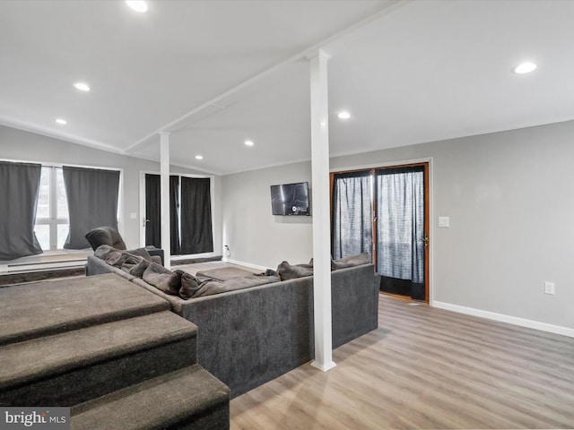 living area featuring lofted ceiling, baseboards, wood finished floors, and recessed lighting