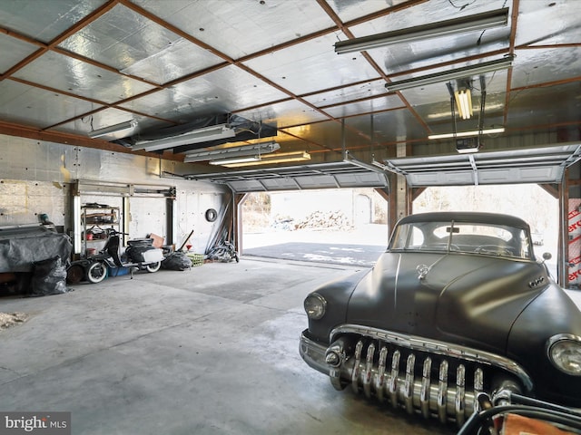 garage featuring a garage door opener