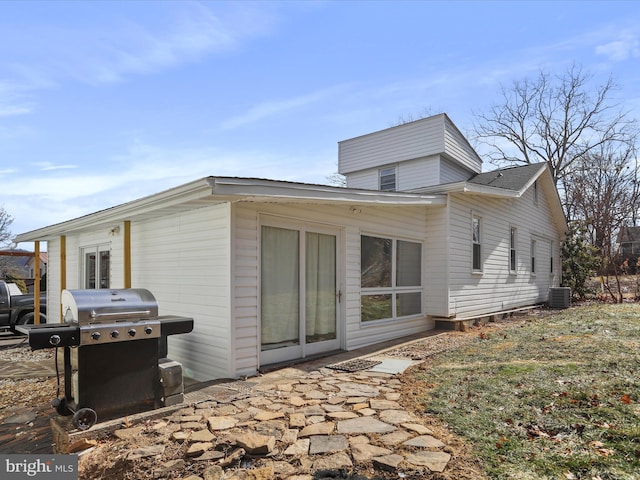 rear view of property featuring central air condition unit